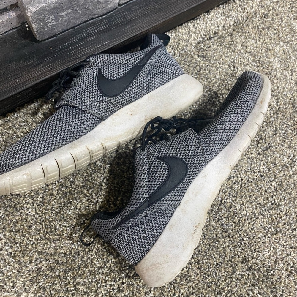 Black and grey Nike shoes